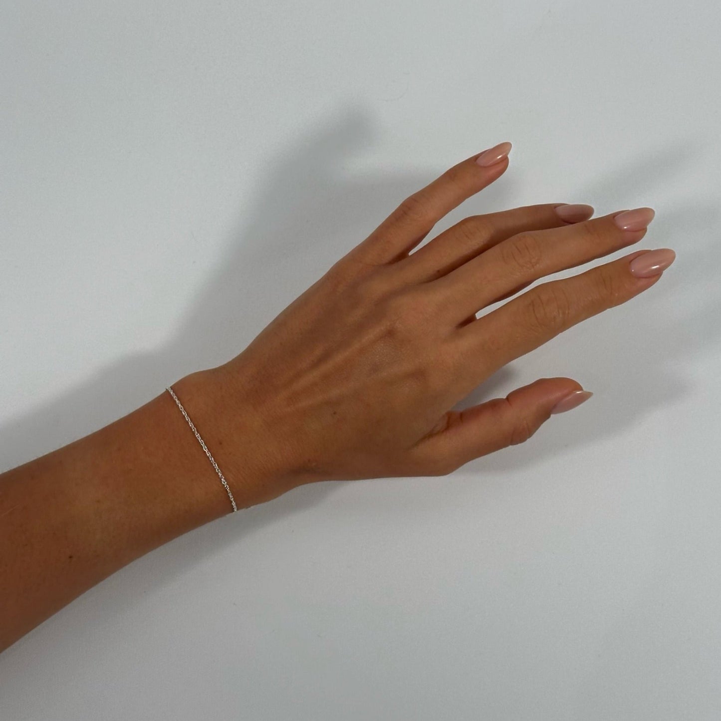lady wearing sterling silver classic fine rope chain bracelet