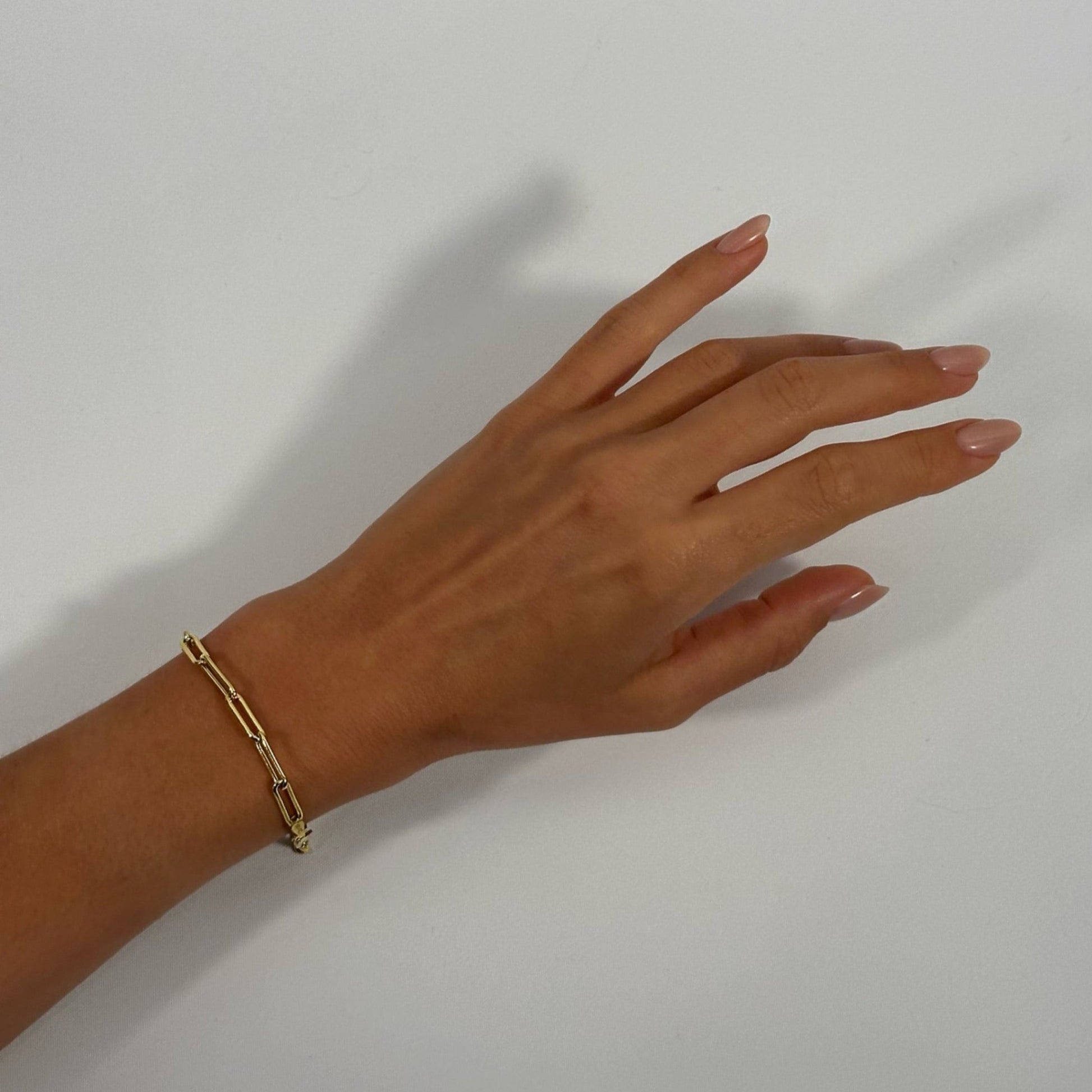 woman wearing 14k gold classic cable chain timeless bracelet