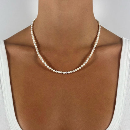 woman wearing classic freshwater wedding pearl beaded necklace 
