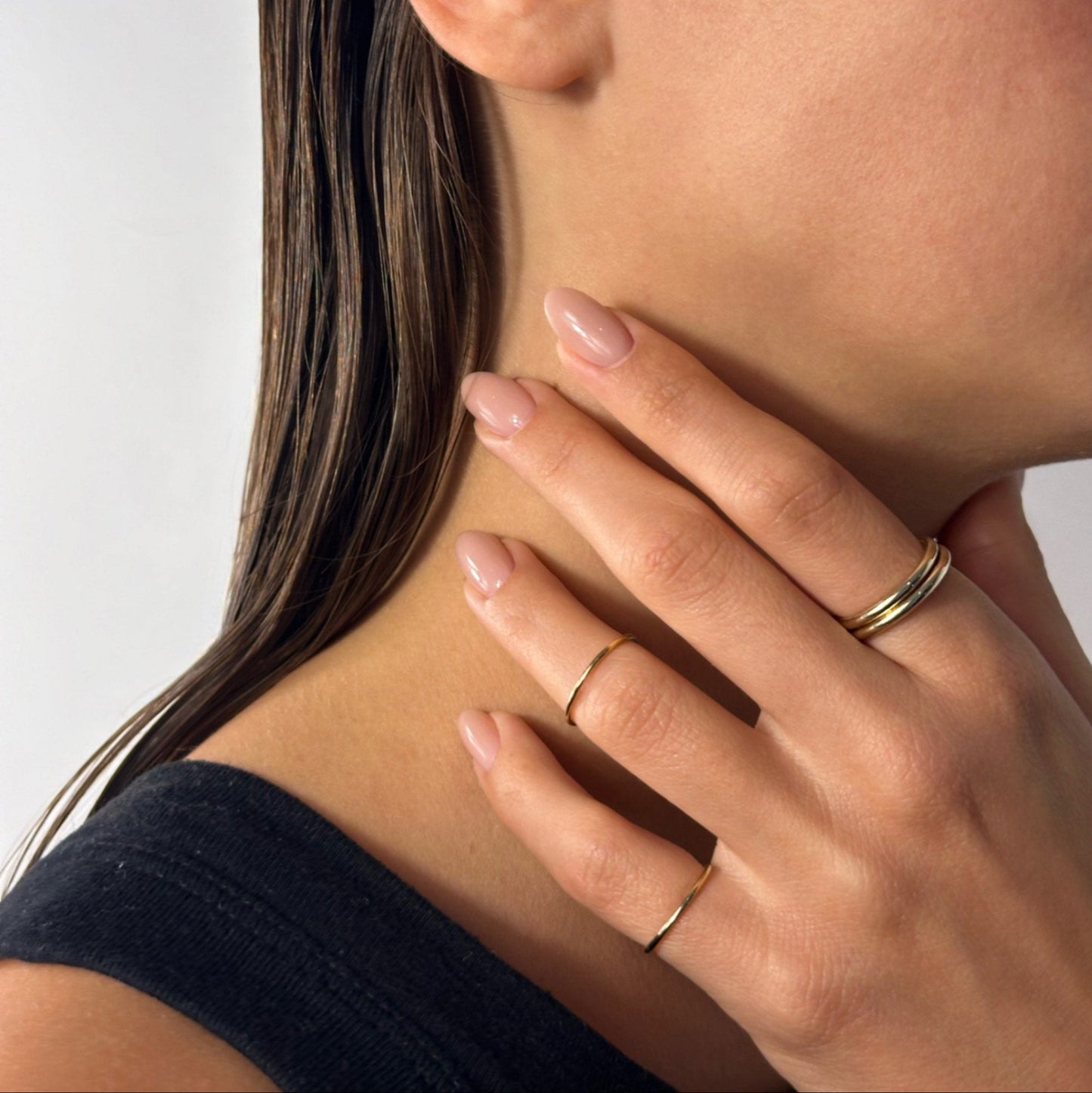 lady wearing gold classic everyday fine band ring