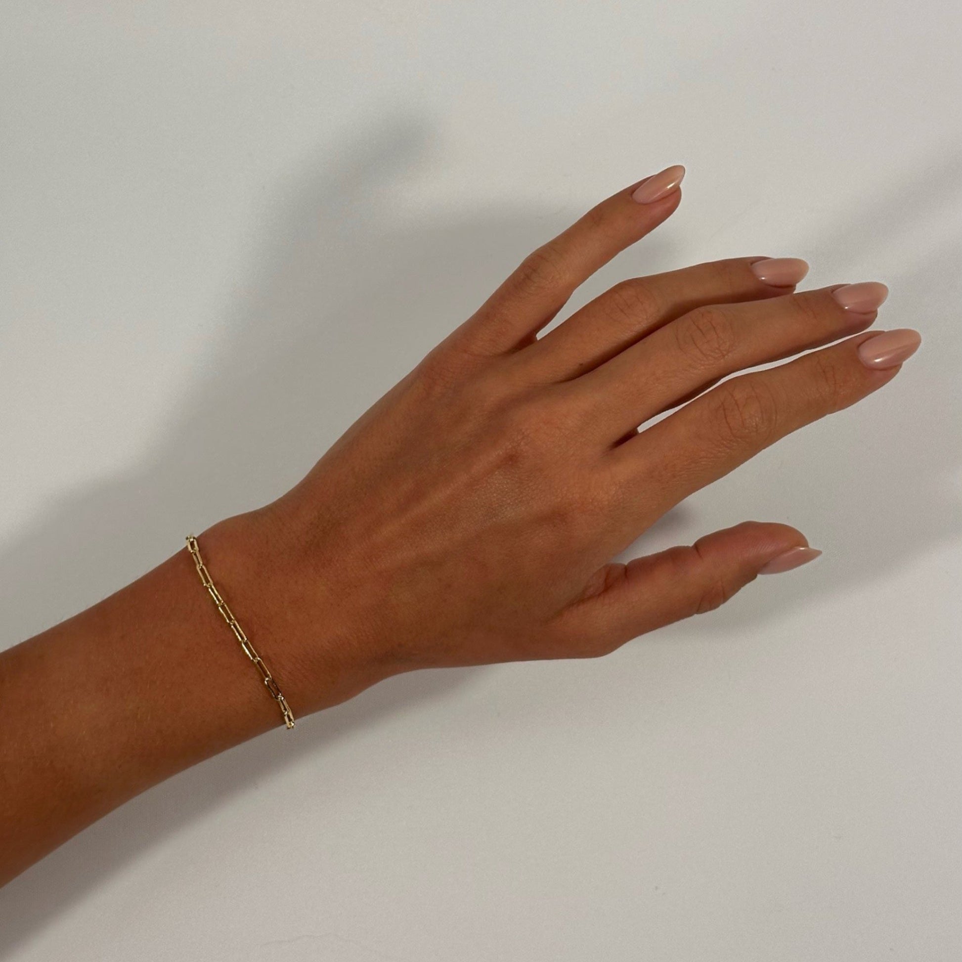 lady wearing gold dainty cable chain bracelet