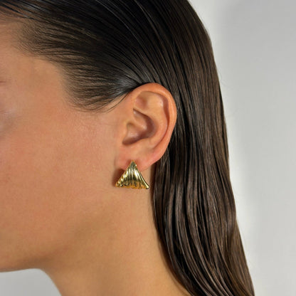 lady wearing  gold filled lined detail triangle statement earrings
