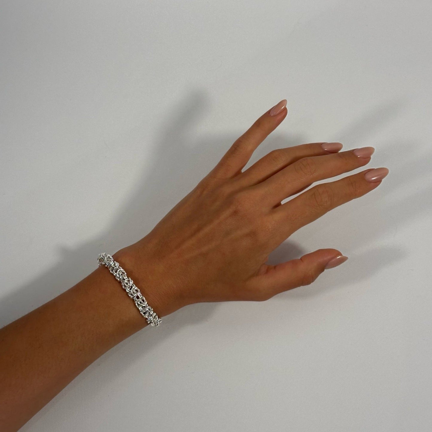 lady wearing silver byzantine bracelet
