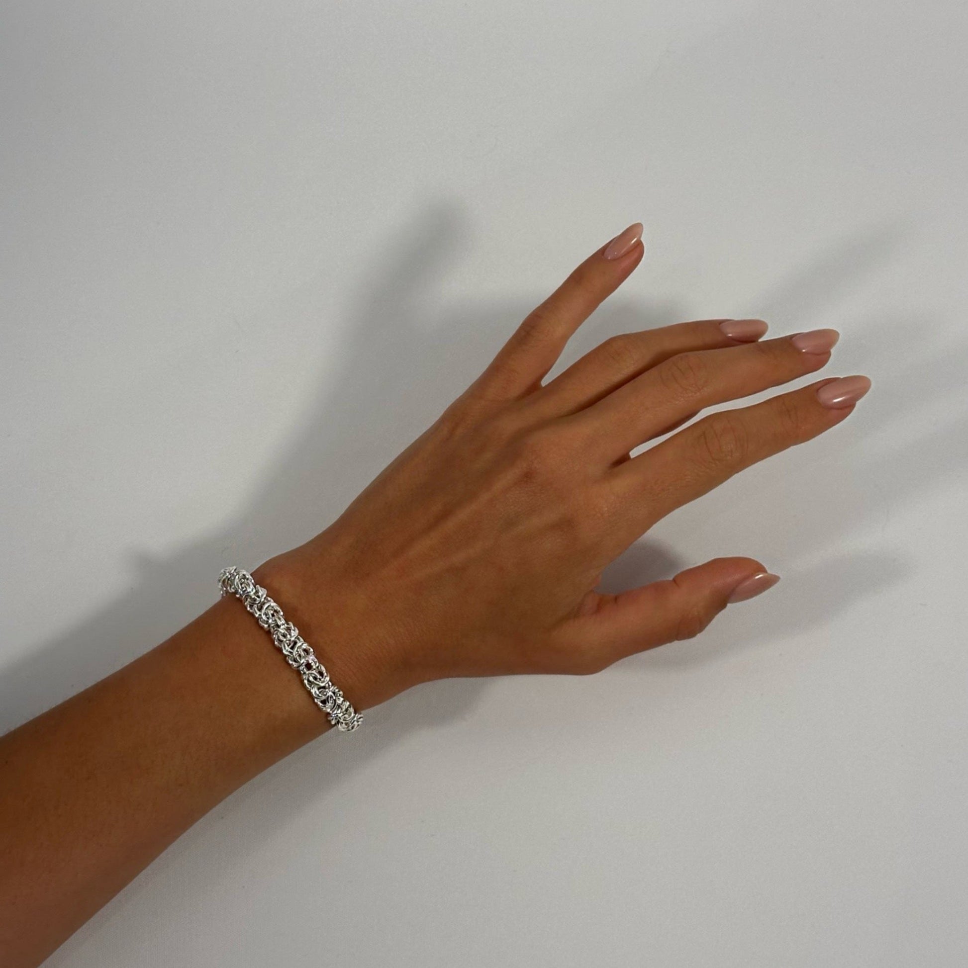 lady wearing silver byzantine bracelet