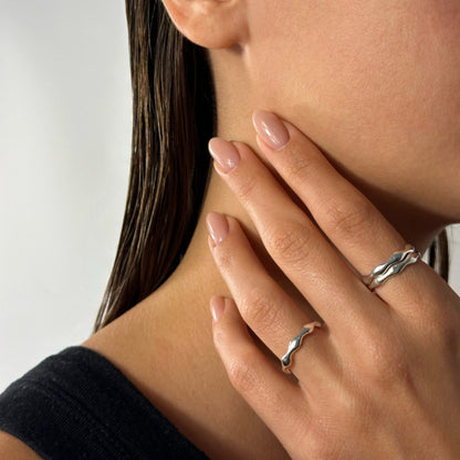woman wearing silver classic timeless dainty statement wave detail ring