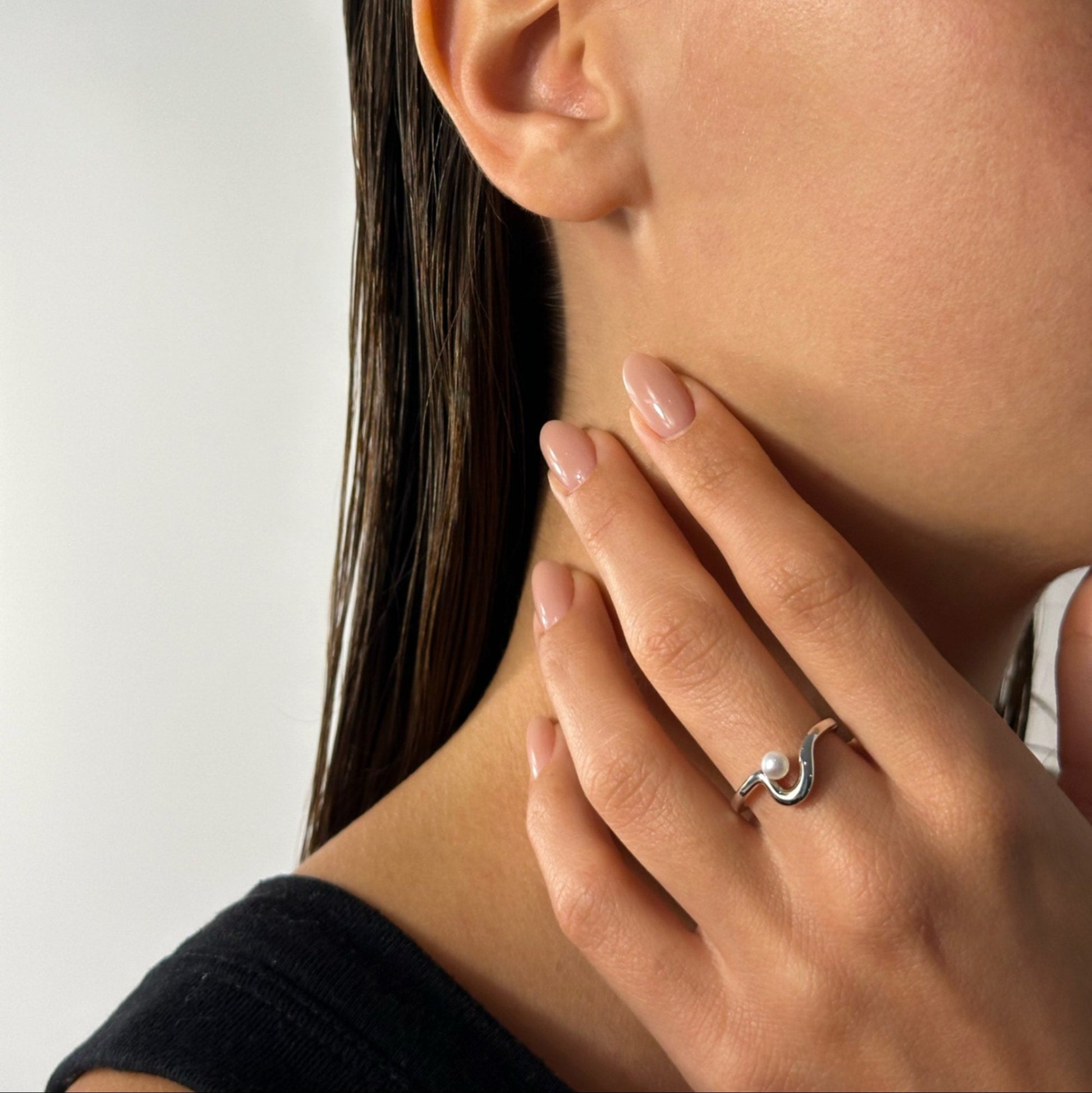 woman wearing sterling silver freeform freshwater pearl ring