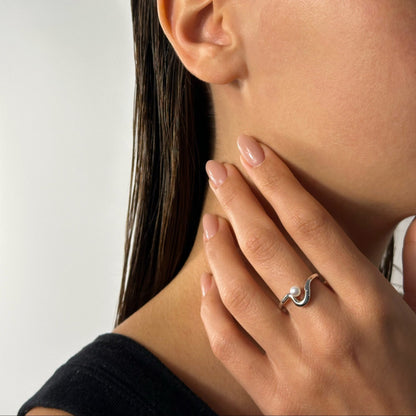 woman wearing sterling silver freeform freshwater pearl ring
