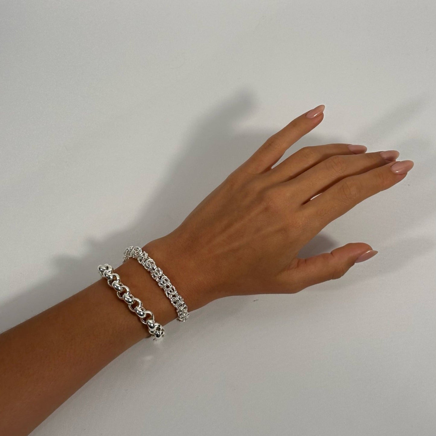 lady wearing sterling silver byzantine and silver rolo bracelet