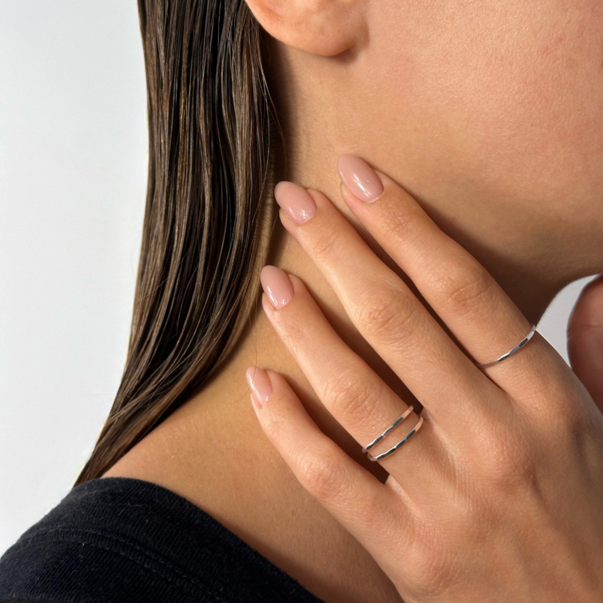 lady wearing dainty sterling silver faceted ring