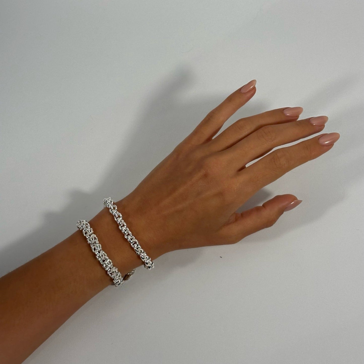 woman wearing sterling silver classic statement rolo chain byzantine bracelet